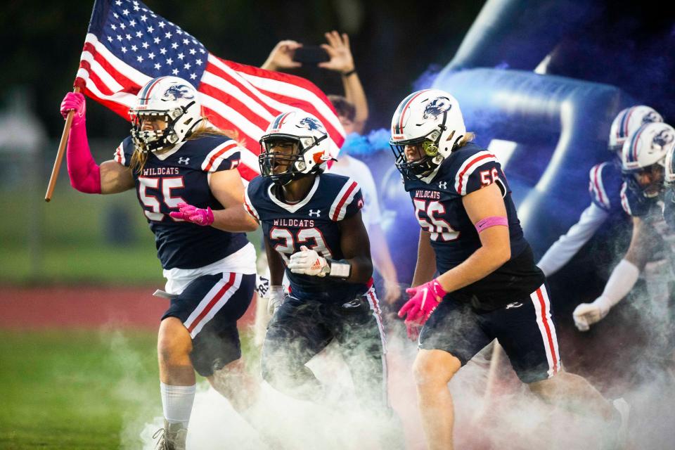 Estero runs onto the field before the Estero and Island Coast football game on Friday, Oct. 22, 2021 at Estero High School in Estero, Fla. 