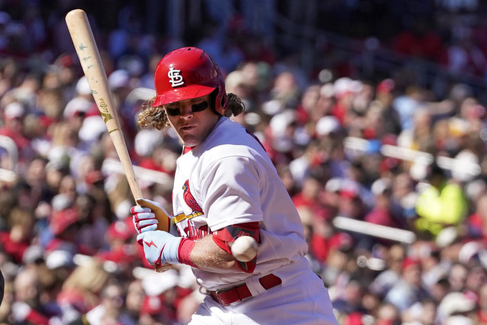 St. Louis Cardinals' Harrison Bader is hit by a pitch during the fifth inning of a baseball game against the Pittsburgh Pirates Saturday, April 9, 2022, in St. Louis. (AP Photo/Jeff Roberson)