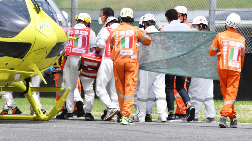 Medical officials, pictured here evacuating Jason Dupasquier into a helicopter after his crash.