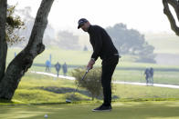 Aaron Rodgers follows his putt on the 16th green of the Pebble Beach Golf Links during the third round of the AT&T Pebble Beach Pro-Am golf tournament in Pebble Beach, Calif., Sunday, Feb. 5, 2023. (AP Photo/Godofredo A. Vásquez)