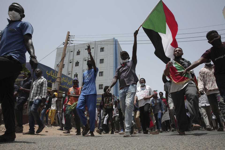 Sudanese anti-military protesters march in demonstrations in the capital of Sudan, Khartoum, on Thursday, June 30, 2022. A Sudanese medical group says at least seven people were killed on Thursday in the anti-coup rallies during which security forces fired on protesters denouncing the country’s military rulers and demanding an immediate transfer of power to civilians. (AP Photo/Marwan Ali)