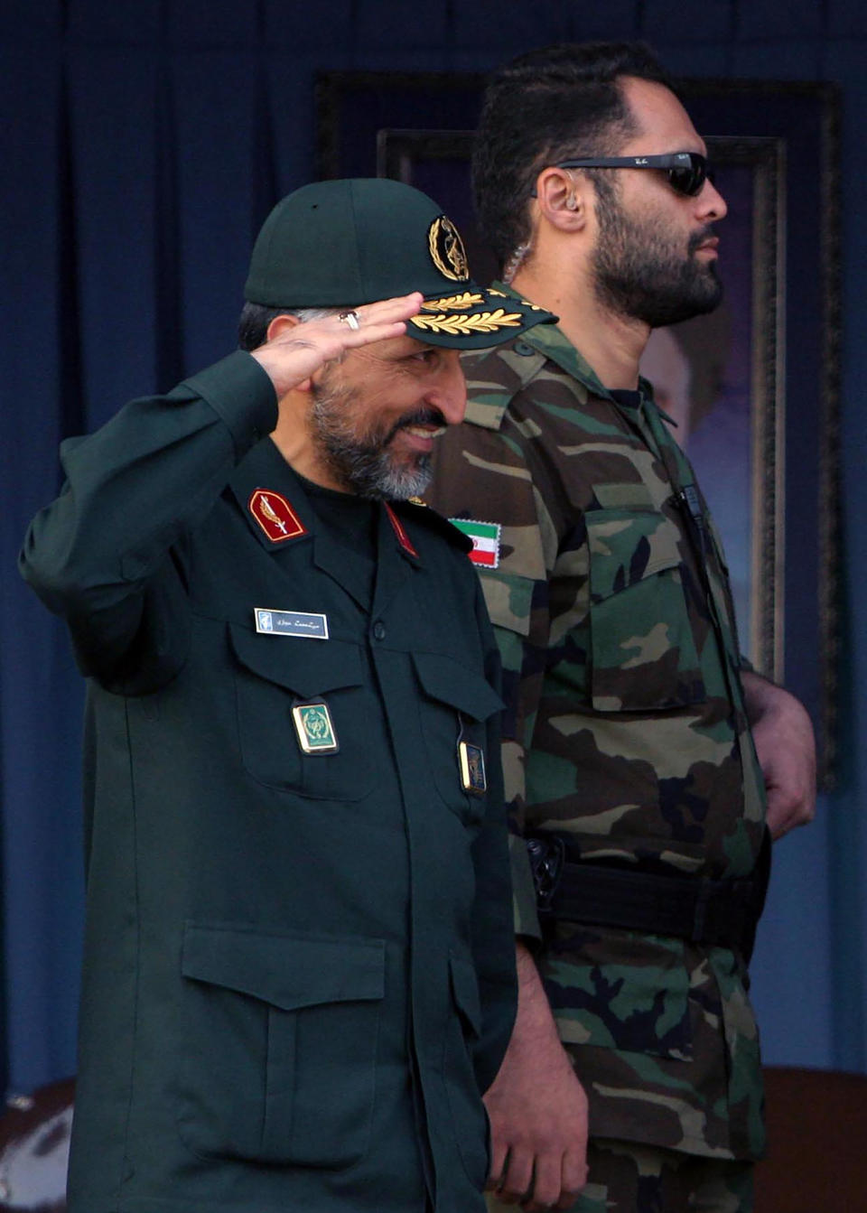 FILE - In this Sunday, Nov. 26, 2006, file photo, Brig. Gen. Mohammad Hosseinzadeh Hejazi salutes in a military parade in Tehran, Iran. Brig. Gen. Hejazi, deputy commander of the Quds, or Jerusalem, force of Iran's paramilitary Revolutionary Guard, has died, the Guard Corps announced on Sunday, April 18, 2021. The unit is an elite and influential group that oversees foreign operations, and Hejazi helped lead its expeditionary forces and frequently shuttled between Iraq, Lebanon and Syria. (AP Photo/Vahid Salemi, File)