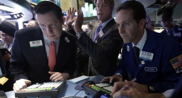 APTOPIX Wall Street (Specialists Gregg Maloney, Patrick Murphy and Glenn Carell, left to right, work at their post during the IP