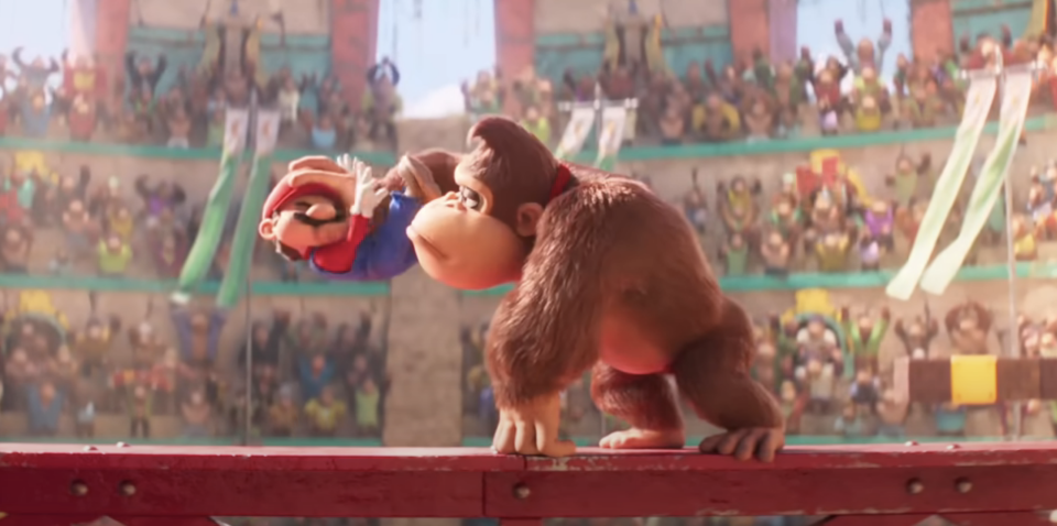 Donkey Kong holding Mario's head