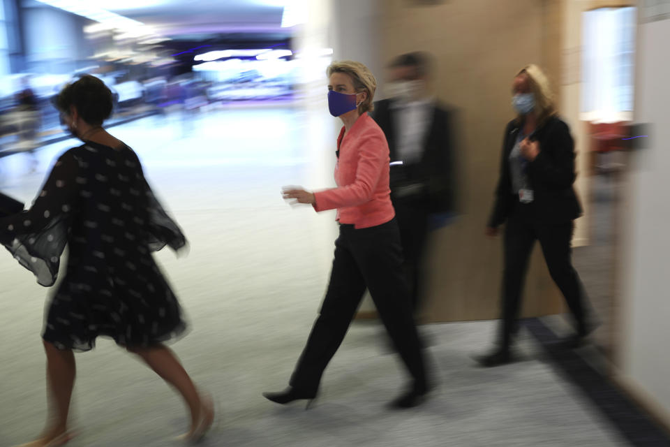 European Commission President Ursula von der Leyen, center, arrives for a plenary session ahead of her first State of the Union speech at the European Parliament in Brussels, Wednesday, Sept. 16, 2020. European Commission President Ursula von der Leyen will set out her vision of the future in her first State of the European Union address to the EU legislators. Weakened by the COVID-19 pandemic and the departure of the United Kingdom, she will center her speech on how the bloc should adapt to the challenges of the future, including global warming, the switch to a digital economy and immigration. (AP Photo, Francisco Seco)