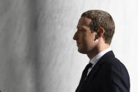 Facebook Chief Executive Officer Mark Zuckerberg arrives for a hearing before the House Financial Services Committee on Capitol Hill in Washington, Wednesday, Oct. 23, 2019, to discuss his plans for the new cryptocurrency Libra. (AP Photo/Susan Walsh)