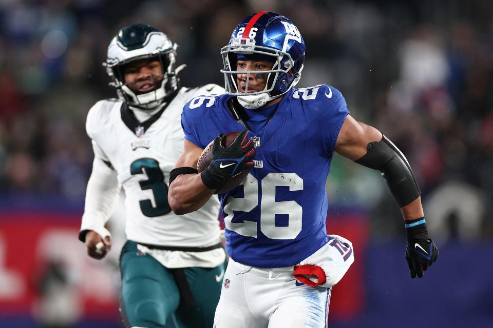 Saquon Barkley #26 of the New York Giants runs the ball after a catch during the second quarter in the game against the Philadelphia Eagles at MetLife Stadium on January 07, 2024 in East Rutherford, New Jersey.