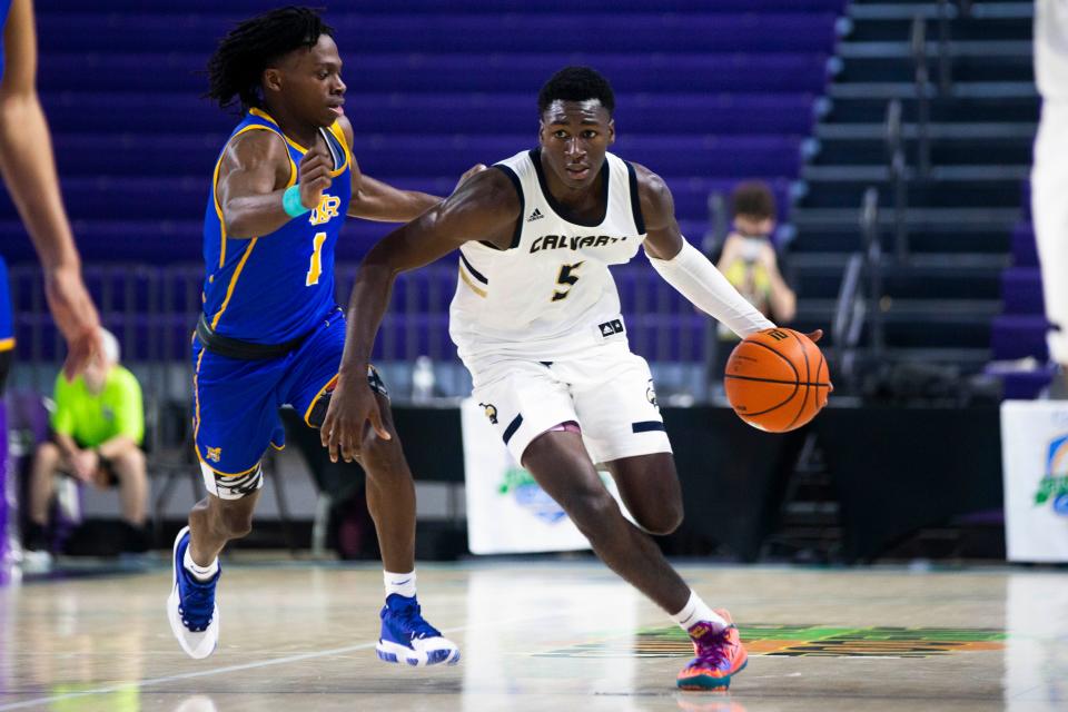 Calvary Christian's Carl Cherenfant (5) dribbles the ball during the 48th annual City of Palms Classic between Calvary Christian and North Little Rock on Wednesday, Dec. 22, 2021 at the Suncoast Credit Union Arena in Fort Myers, Fla. 