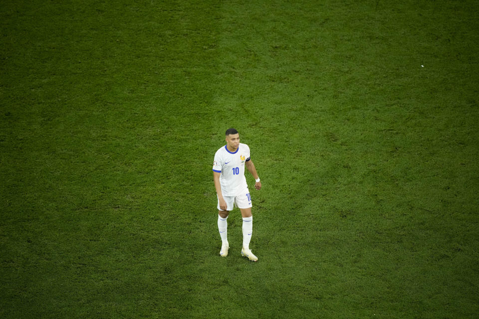 Kylian Mbappe of France leaves the pitch at the end of a semifinal match between Spain and France at the Euro 2024 soccer tournament in Munich, Germany, Tuesday, July 9, 2024. Spain won 2-1. (AP Photo/Ebrahim Noroozi)