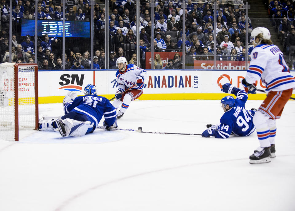 TORONTO, ON - DECEMBER 28: Tony DeAngelo #77 of the New York Rangers scores the game winning goal against Frederik Andersen #31 of the Toronto Maple Leafs in overtime at the Scotiabank Arena on December 28, 2019 in Toronto, Ontario, Canada. (Photo by Andrew Lahodynskyj/NHLI via Getty Images)