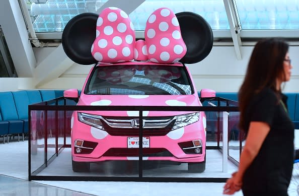 A woman walks past a display Minnie model of the 2018 Honda Odyssey at the 2017 LA Auto Show on November 29, 2017 in Los Angeles, California. (FREDERIC J. BROWN/AFP/Getty Images)