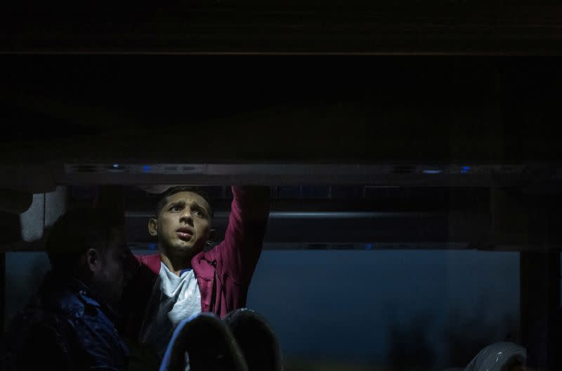 The Wider Image: The toll on migrants of a free bus north from the border