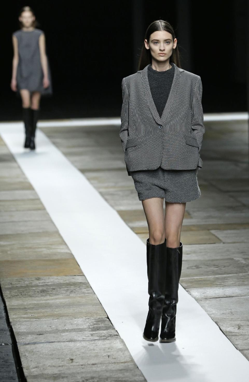 Models walk the runway during the Theyskens Theory Fall 2013 show at Fashion Week in New York, Monday, Feb. 11, 2013. (AP Photo/Kathy Willens)