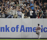 Boston Red Sox's J.D. Martinez (28) watches as fans reach for a home run by New York Yankees' Luke Voit during the fourth inning of a baseball game Wednesday, Sept. 19, 2018, in New York. (AP Photo/Frank Franklin II)