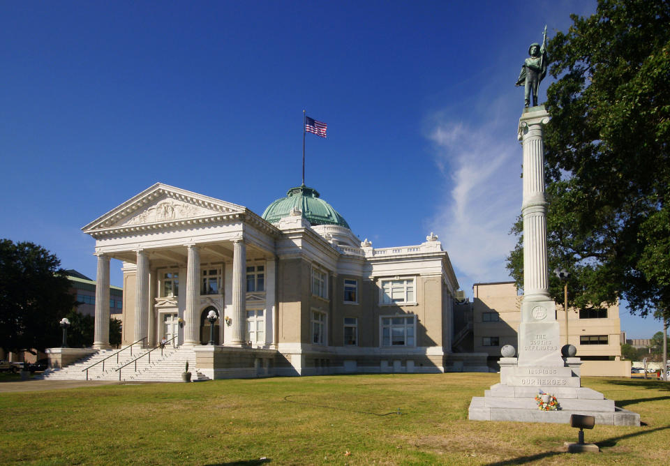 Courthouse sitting on a green lawn