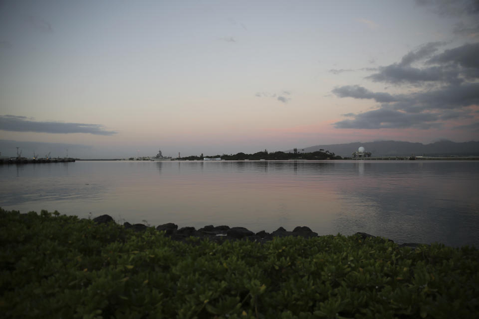 Pearl Harbor is shown ahead of a ceremony to mark the anniversary of the Japanese attack, Monday, Dec. 7, 2020, in Pearl Harbor, Hawaii. Officials gathered in Pearl Harbor to remember those killed in the 1941 Japanese attack, but public health measures adopted because of the coronavirus pandemic meant no survivors were present. The military broadcast video of the ceremony live online for survivors and members of the public to watch from afar. A moment of silence was held at 7:55 a.m., the same time the attack began 79 years ago. (AP Photo/Caleb Jones, Pool)