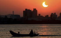 The solar eclipse is seen over the Tamsui River, northern Taiwan, January 15, 2010. The annular eclipse of the sun, which will last for over 11 minutes during its maximum duration, will be visible from a 300-km wide track that passes half of the earth, according to NASA. REUTERS/Stringer