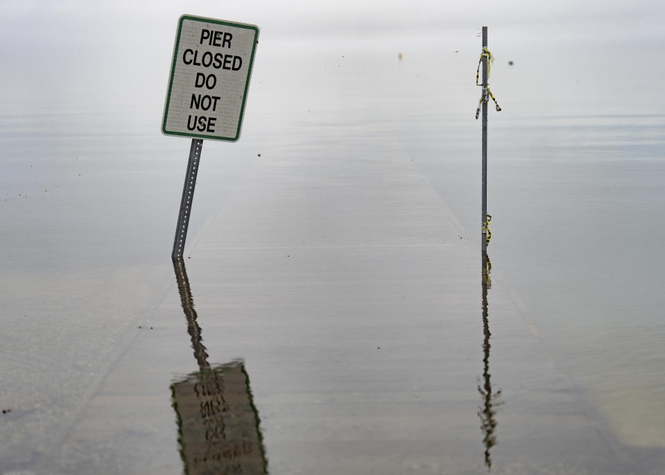 The dock near the boat ramp for Lake Conroe at FM 830 is seen under water after the region received its third day of heavy rainfall, Wednesday, Jan. 24, 2024, in Conroe, Texas. The San Jacinto River Authority closed the lake to boating and other activities for safety reasons. (Jason Fochtman/Houston Chronicle via AP)