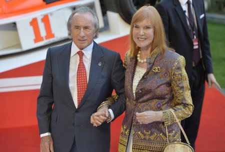 Former Formula One driver Jackie Stewart and his wife Helen arrive at the world premiere of Rush at a cinema in Leicester Square, central London, September 2, 2013. REUTERS/Toby Melville