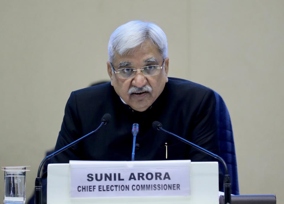 India's Chief Election Commissioner Sunil Arora listens to a question from a journalist during a press conference in New Delhi, India, Sunday, March 10, 2019. India's Election Commission has announced that the upcoming national election will be held in seven phases in April and May as Prime Minister Narendra Modi's Hindu nationalist party seeks a second term. (AP Photo/ Manish Swarup)