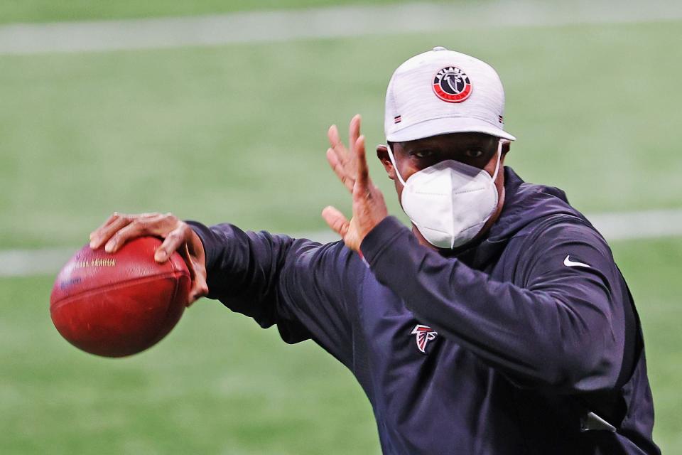 ATLANTA, GEORGIA - DECEMBER 06: Interim head coach Raheem Morris of the Atlanta Falcons throws the ball during pregame warm-ups prior to the game against the New Orleans Saints at Mercedes-Benz Stadium on December 06, 2020 in Atlanta, Georgia. (Photo by Kevin C. Cox/Getty Images)