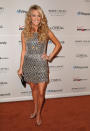 Wearing her loose locks a little wild and down, Underwood shimmered at Clive Davis’ Pre-Grammy Awards party in 2007, thanks to this tiered silver cocktail dress, which showed off her toned arms and legs. (2/10/2007)