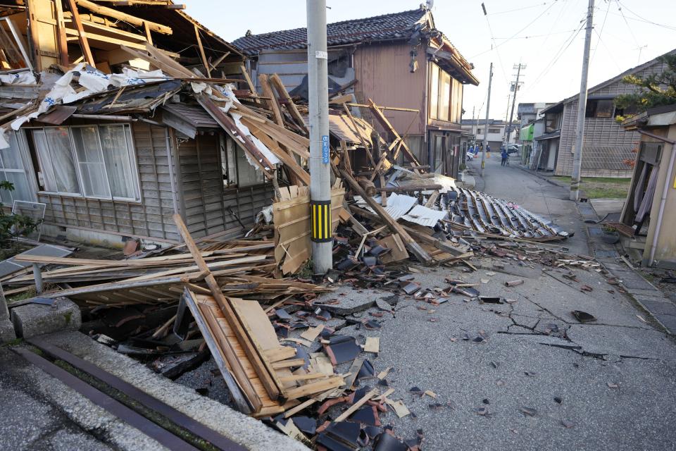 Collapsed houses damaged by powerful earthquake are seen in Anamizu in the Noto peninsula facing the Sea of Japan, northwest of Tokyo, Thursday, Jan. 4, 2024. More soldiers have been ordered to bolster the rescue operations Thursday, providing those in need with drinking water, hot meals and setting up bathing facilities after a magnitude 7.6 quake hit Ishikawa Prefecture and nearby regions Monday. (AP Photo/Hiro Komae)