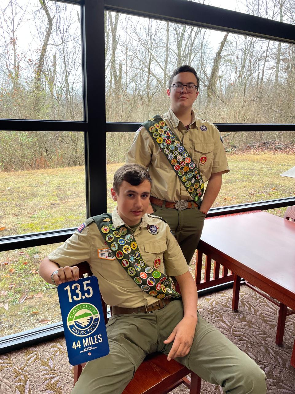 Andrew Phillips (standing) and Henry Jordan completed their Eagle Scout projects by mapping Beaver Creek and posting mileage signs along the bank to help first responders with any emergency.