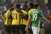 Jul 23, 2017; Pasadena, CA, USA; Jamaica celebrates a goal by defender Kemar Lawrence (20) during the second half against the Mexico at Rose Bowl. Kelvin Kuo-USA TODAY Sports