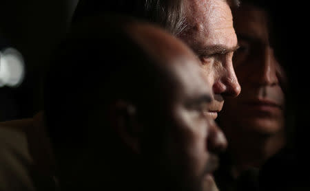 Presidential candidate Jair Bolsonaro talks to media after a visit to Federal Police headquarters in Rio de Janeiro, Brazil October 17, 2018. REUTERS/Ricardo Moraes