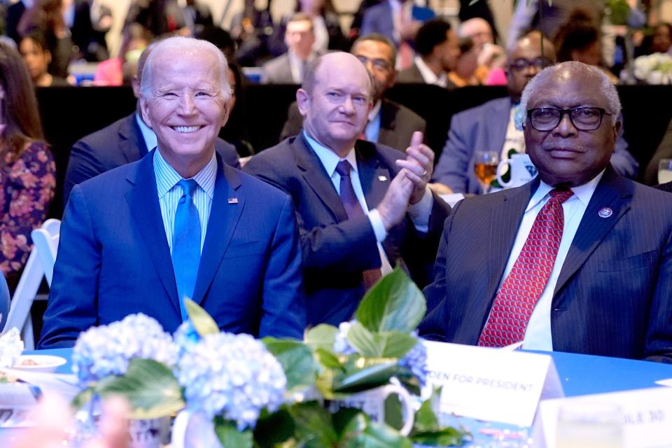 President Joe Biden, left, and Rep. Jim Clyburn, D-S.C., right, sit in the audience at South Carolina's First in the Nation dinner at the South Carolina State Fairgrounds in Columbia, S.C., Saturday, Jan. 27, 2024. (AP Photo/Jacquelyn Martin)