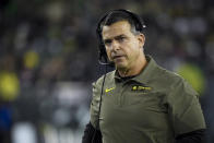 FILE -O regon head coach Mario Cristobal watches the action during the third quarter of an NCAA college football game Saturday, Nov. 13, 2021, in Eugene, Ore. Manny Diaz was fired as Miami’s football coach Monday, Dec. 6, 2021, after a 7-5 regular season and with the school in deep negotiations to bring Oregon coach Mario Cristobal back to his alma mater to take over. (AP Photo/Andy Nelson, File)