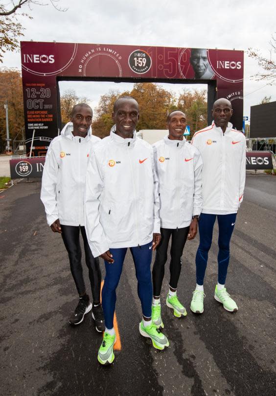 Kipchoge poses with his pacemakers Jonathan Korir, Augustine Choge and Gideon Kipketer (PA)