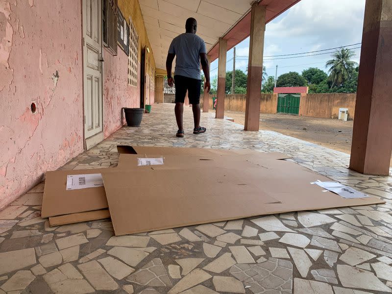 FILE PHOTO: Dismantled voting booths are seen on the ground at an empty polling station during the presidential election in Blockausso on the outskirts of Abidjan