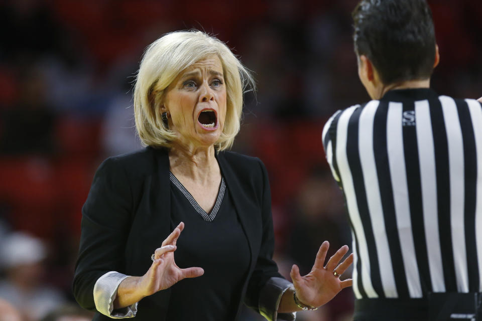 Baylor head coach Kim Mulkey talks with an official in the first half of an NCAA college basketball game against Oklahoma in Norman, Okla., Saturday, Jan. 4, 2020. (AP Photo/Sue Ogrocki)