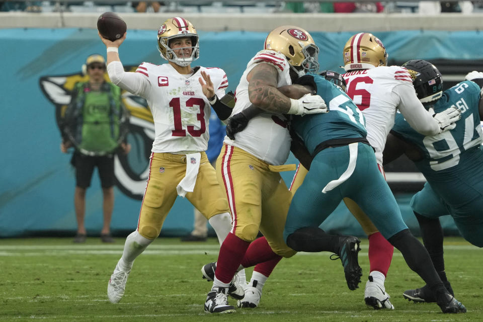 San Francisco 49ers quarterback Brock Purdy (13) stands back to pass during the second half of an NFL football game against the Jacksonville Jaguars, Sunday, Nov. 12, 2023, in Jacksonville, Fla. (AP Photo/John Raoux)