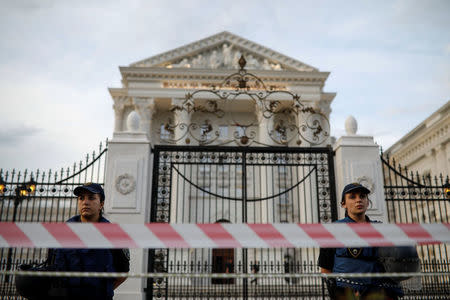 Police officers stand in front of the government building in central Skopje, Macedonia, June 2, 2018. REUTERS/Marko Djurica