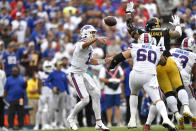 Buffalo Bills quarterback Josh Allen (17) gets off a pass under pressure by Pittsburgh Steelers defensive end Tyson Alualu (94) during the first half of an NFL football game in Orchard Park, N.Y., Sunday, Sept. 12, 2021. (AP Photo/Adrian Kraus)