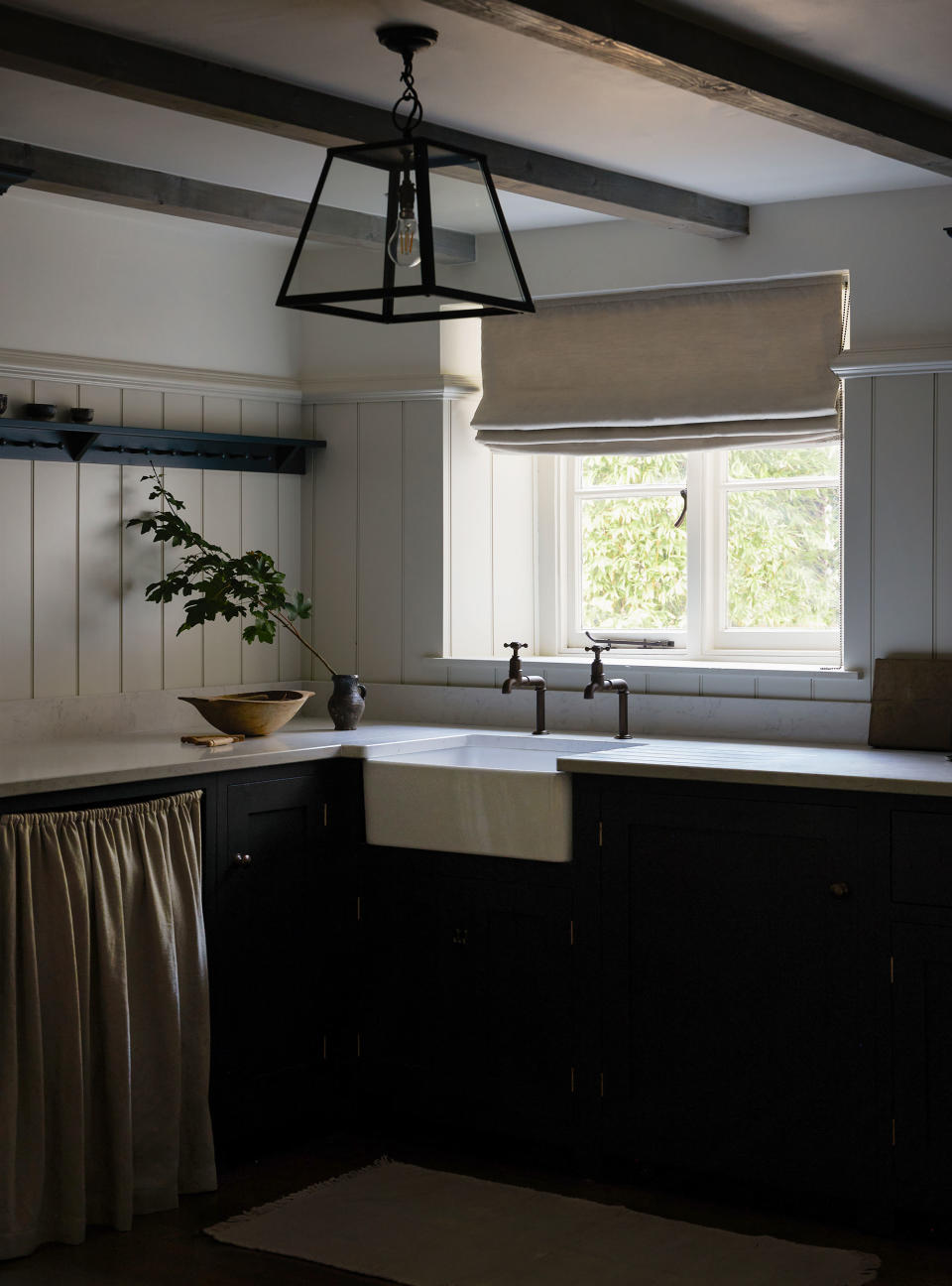 Modern gray and white kitchen with shiplap walls