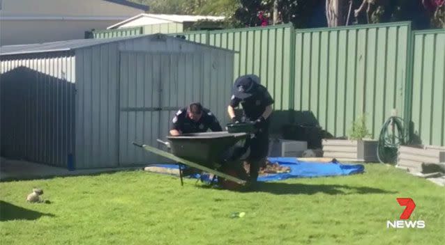 Police at the family's former home. Source: 7 News