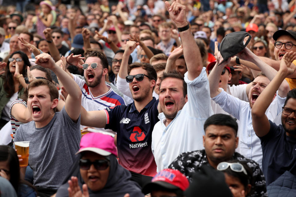 Fans react as they watch a big screen in the Fanzone at Trafalgar Square during the Cricket World Cup Final between New Zealand and England at the ICC Fanzone, London.