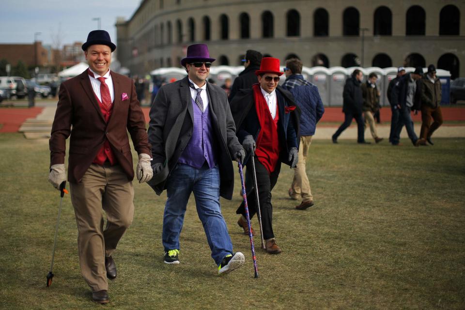 Harvard University football fans arrive for a pre-game tailgate-style party outside the stadium before their football game against Yale University at Harvard in Cambridge, Massachusetts November 22, 2014. Known as "The Game," the first Harvard versus Yale football game was played in 1875, making it one of the oldest rivalries in college sports. REUTERS/Brian Snyder (UNITED STATES - Tags: EDUCATION SPORT FOOTBALL SOCIETY)