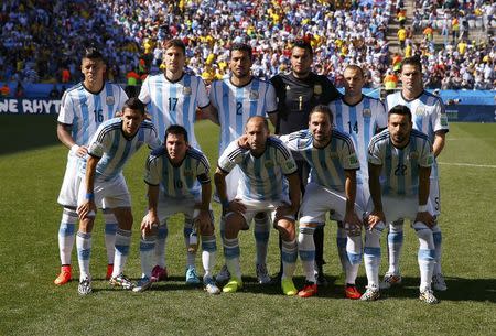 Argentina's national soccer players pose for a team photo before their 2014 World Cup round of 16 game against Switzerland at the Corinthians arena in Sao Paulo July 1, 2014. REUTERS/Paul Hanna