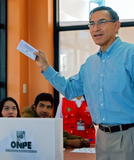 The opposition accused Peruvian President Martin Vizcarra, pictured casting his vote on January 26, 2020, of a accused him of a "coup d'etat"