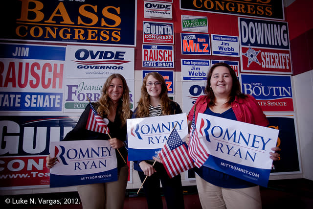 Romney supporters pose with campaign signs after a rally featuring Paul Ryan in Derry, N.H., on Sept. 29, 2012. (Luke N. Vargas, Political Courier Media)