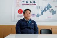 Kim Kyung-sig, chief officer of CNTUS-Sungjin mask factory, attends an interview with Reuters in Icheon