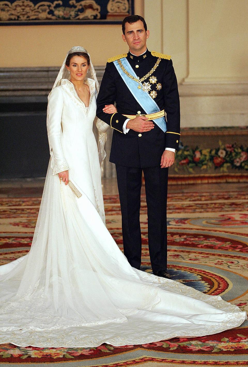 Spanish Crown Prince Felipe of Spain and his wife Princess of Asturias Letizia Ortiz pose inside the Royal Palace in Madrid 22 May 2004 (AFP via Getty Images)