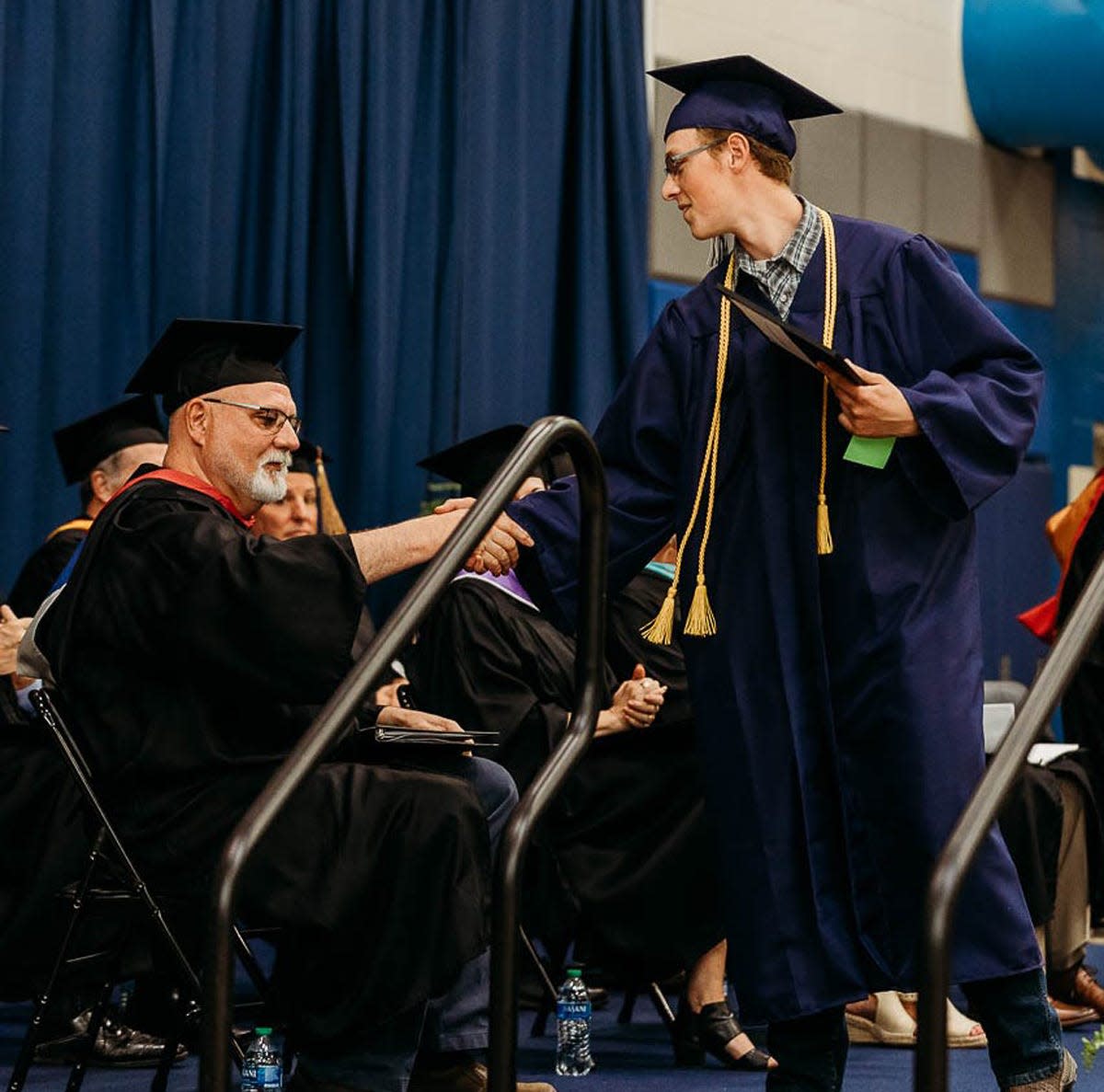 Daniel Hammond crosses the stage during the Spoon River College commencement ceremony. He and Matthew Schaad were recipients of this year's Student Achievement Awards.