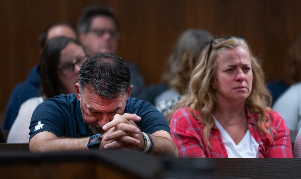 Buck Myre, left, and Sheri Myre parents of slain son Tate Myre, listen to testimony as their son's killer, Ethan Crumbley appears in the Oakland County courtroom of Kwame Rowe, on Friday, Aug. 18, 2023, in Pontiac, Mich. The Oakland County Prosecutors are making their case that Crumbley, a teenager, should be sentenced to life without parole for killing four students at Oxford High School in 2021.