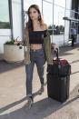 <p>Model and actress Emily Ratajkowski arrives at Nice Airport ahead of the 2017 Cannes Film Festival. Emily was dressed casually in a brown jacket, a black crop top and a pair of blue jeans. (Photo: AKM-GSI) </p>